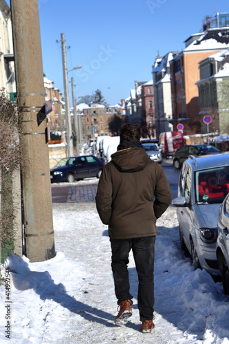 person walking in the snow