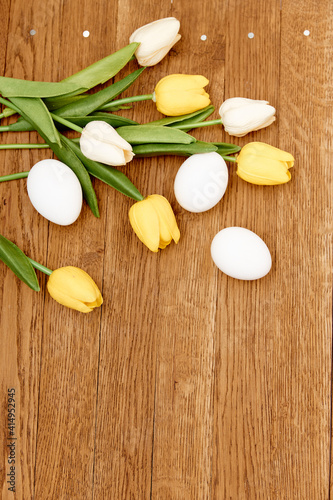 bouquet of flowers chicken eggs wooden background Copy Space