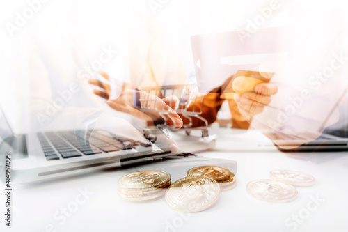 businesswoman holding coins putting in glass with using smartphone and calculator to calculate concept saving money for finance accounting