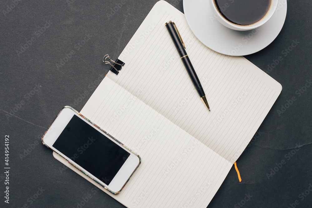 coffee cup on the table notepad with a pen phone technology coffee cup on the table notepad with a pen phone technology