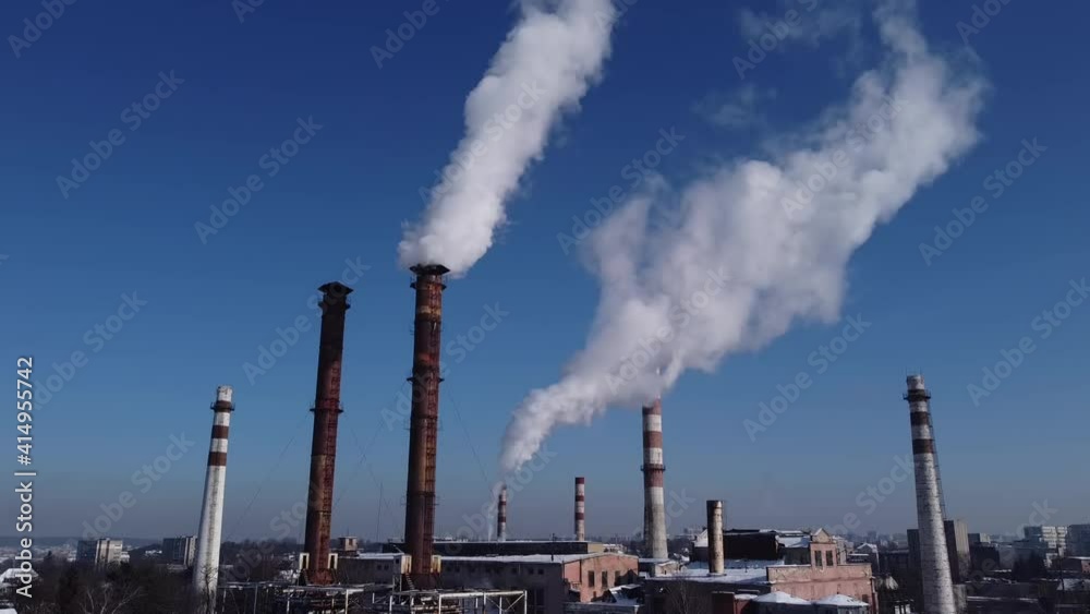 Aerial view of a drone flying over an industrial plant. Plant pipes. Aerial view of a drone flying over an industrial plant. Plant pipes.