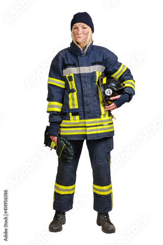 Young brave woman in uniform firefighter holds gloves and hardhat in hands and looking at camera isolated on white background. 