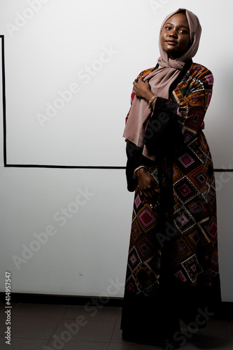 Black girl weared hijab smile and rejoise on white background. Muslim happy woman posing in studio. Attractive african female. photo