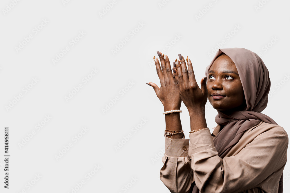Black woman pray in god. Religious girl on white background. Islamic religion Black woman pray in god. Religious girl on white background. Islamic religion