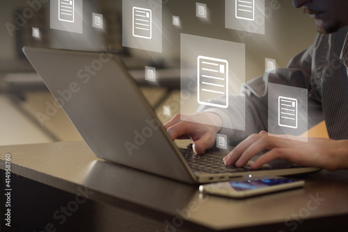 Texsts flying away from laptop. Person sending mail in office. Communication, remote working and editing concept