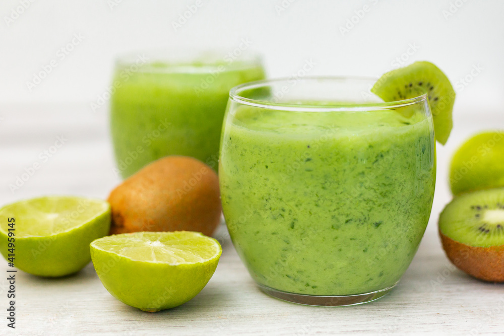 Healthy dieting and nutrition, food and drink, vegan, vegetarian concept, healthy lifestyle. Green smoothie with organic ingredients, vegetables on a wooden table Healthy dieting and nutrition, food and drink, vegan, vegetarian concept, healthy lifestyle. Green smoothie with organic ingredients, vegetables on a wooden table