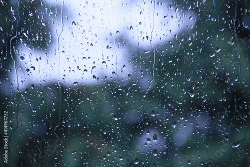 Rain drops on glass window macro closeup. Abstract background texture. Graphic resource.