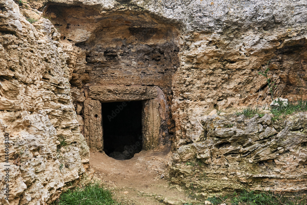 entrance to the ancient catacombs, carved into the rock