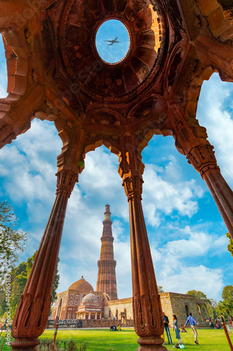 Qutub Minar a highest minaret in India standing 73 m tall tapering tower of five storeys made of red sandstone. It is UNESCO world heritage site at New Delhi, India photo