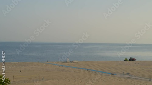 Rising Aerial Shot from Trees to a Sandy Beach in Long Island photo