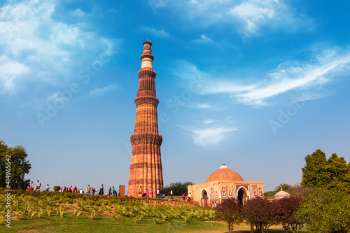Fototapeta Qutub Minar a highest minaret in India standing 73 m tall tapering tower of five storeys made of red sandstone