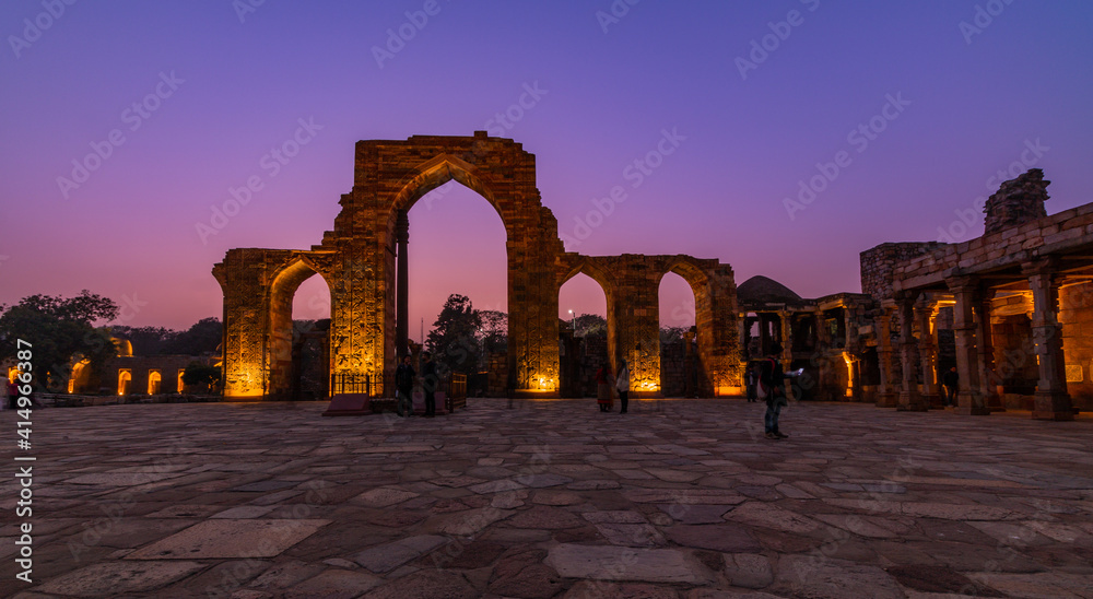 Fototapeta premium Qutub Minar a highest minaret in India standing 73 m tall tapering tower of five storeys made of red sandstone. It is UNESCO world heritage site at New Delhi, India