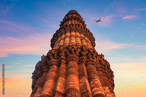 Qutub Minar a highest minaret in India standing 73 m tall tapering tower of five storeys made of red sandstone. It is UNESCO world heritage site at New Delhi, India photo