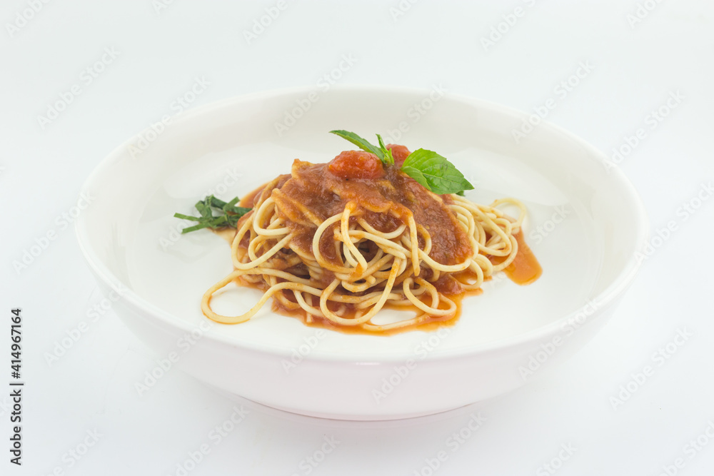 Spaghetti with tomato sauce in white plate on white background