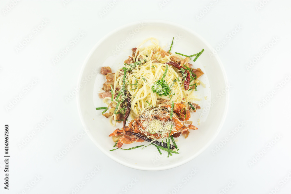 Spaghetti soft shell crab and cheese in white plate on white background Spaghetti soft shell crab and cheese in white plate on white background