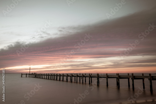A Pier at Fairhope View during sunset