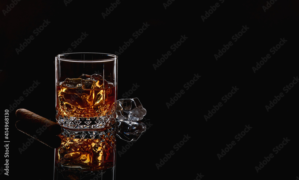 Whiskey with ice or brandy in glass with cigar on black background. Whisky  with ice in glass. Whiskey or brandy. Selective focus. Stock-Foto | Adobe  Stock