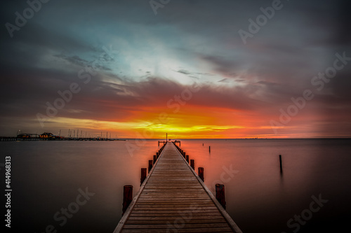 A Pier at Fairhope View during sunset