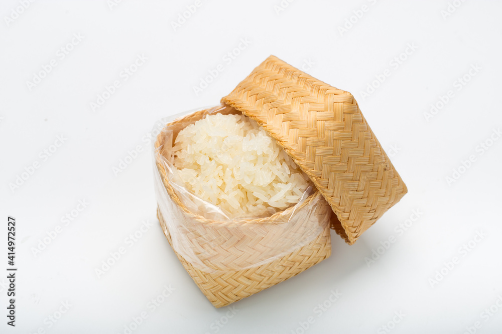 Thai sticky rice in a bamboo wooden on white background Thai sticky rice in a bamboo wooden on white background
