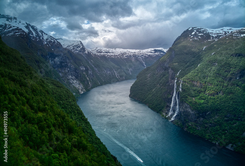 Seven sisters waterfall in Norway. Dramatic sky in Norvegian fjords.