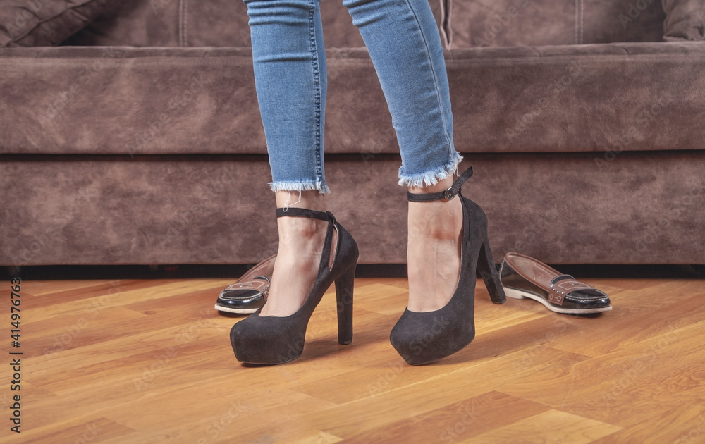 Woman with a black high heel shoes and comfortable shoes. Woman with a black high heel shoes and comfortable shoes.