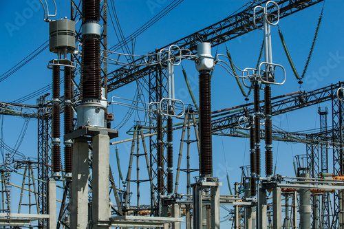 High-voltage equipment. Distribution substation of power generating plant. Transformer station. Blue sky background.