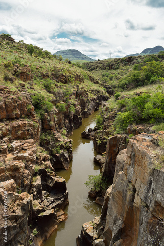 River in the valley between mountains in Bourke's Luck Potholes, Blyde River Canyon, South Africa.