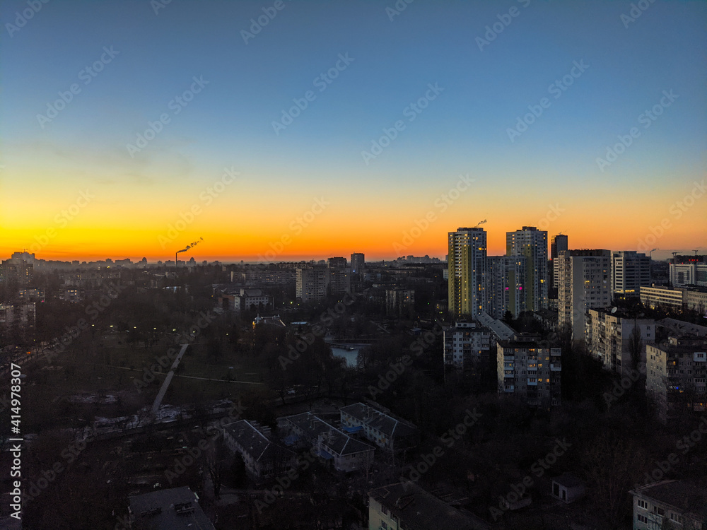 city of Kyiv at dusk with the clear sky and the beautiful colors in winter without snow