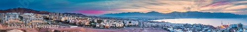 Aerial scenic panorama of the Red Sea, mountains and buildings of Eilat city - famous tourist resort and recreational place in Israel
