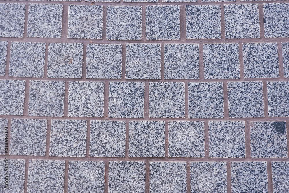 Gray, granite, square paving stones. Natural chipped stone. Gray, granite, square paving stones. Natural chipped stone.