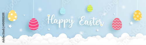 Easter horizontal banner with  Colorful Easter eggs and clouds paper cut concept. 