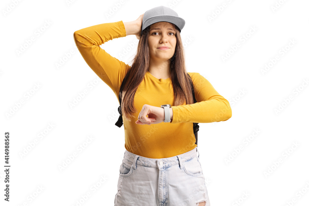 Unhappy female student checking time on watch Unhappy female student checking time on watch
