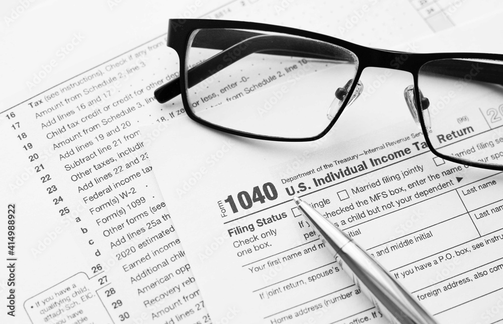 Filling the 1040 Tax Form. Standard US Income Tax Return form. Filling the 1040 Tax Form. Standard US Income Tax Return form.