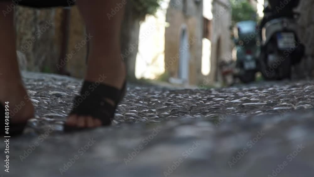 Old senior lady walking with stick. Close up feetof grandma. Old senior lady walking with stick. Close up feetof grandma.