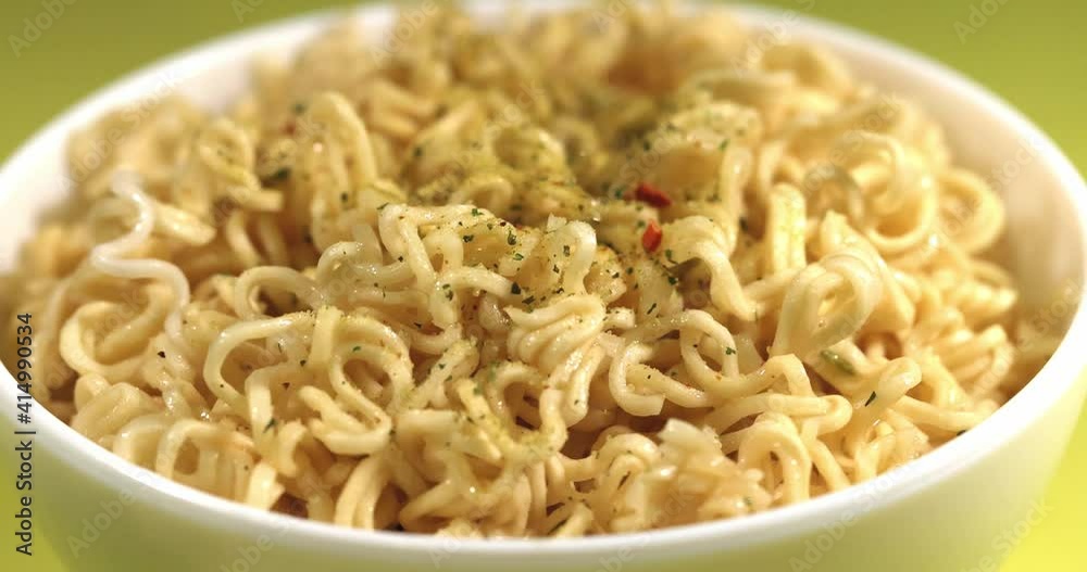 Cooking instant noodles. Sprinkle spices on the noodles. Super slow motion Cooking instant noodles. Sprinkle spices on the noodles. Super slow motion