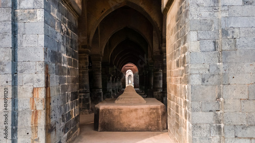 A stone tomb in an arcaded hall at the ruins of the ancient Adina Masjid mosque in the village of Pandua. photo