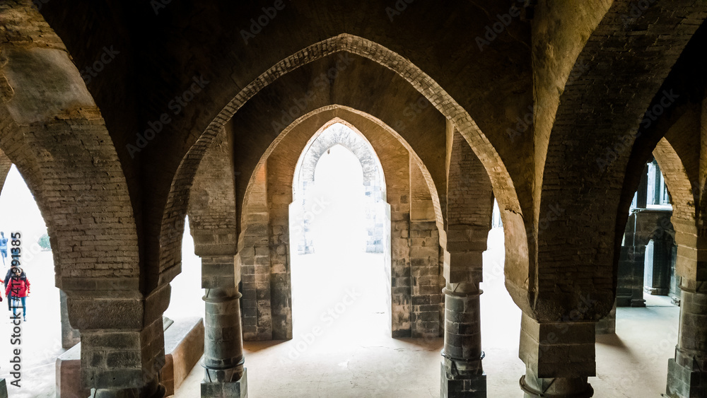Malda, West Bengal, India - January 2018: The arches in the arcaded corridors and interiors of the ancient Adina Masjid mosque in the village of Pandua.
