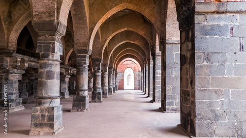 Malda, West Bengal, India - January 2018: The arches in the arcaded corridors and interiors of the ancient Adina Masjid mosque in the village of Pandua.