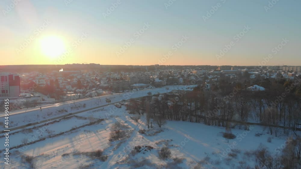 Sunset over the city aerial drone view winter snow Irpin Ukraine Sunset over the city aerial drone view winter snow Irpin Ukraine