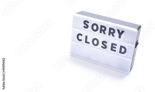 sorry closed, words on lightbox on white background flat lay. 