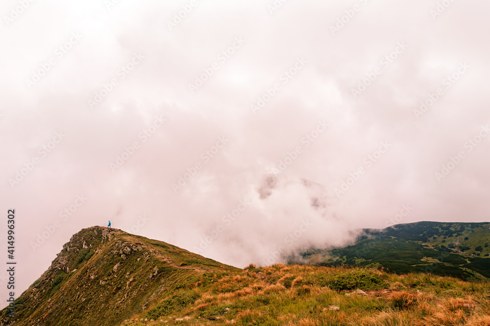 Montenegrin ridge in the clouds, Gutyn Tomnatyk mountain in the clouds, picturesque and fascinating magical landscapes from the mountain to the valleys.