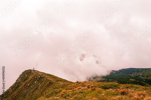 Montenegrin ridge in the clouds, Gutyn Tomnatyk mountain in the clouds, picturesque and fascinating magical landscapes from the mountain to the valleys.