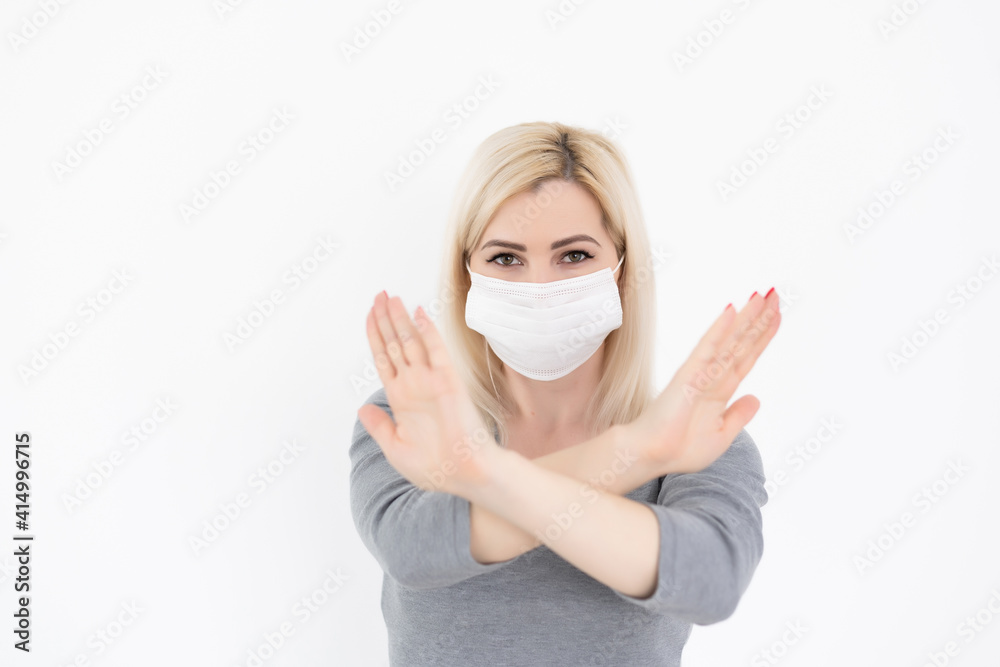 Stop the virus and epidemic diseases. Healthy woman in medical protective mask showing gesture stop. Health protection and prevention during flu and infectious outbreak. Stop the virus and epidemic diseases. Healthy woman in medical protective mask showing gesture stop. Health protection and prevention during flu and infectious outbreak.
