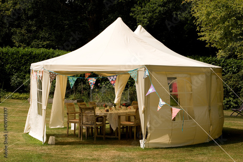 Fototapeta A summer tent or marquee set for a garden lunch party.