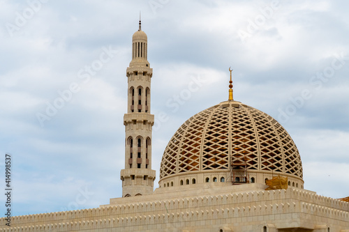 Dome and minaret of Sultan Qaboos Grand Mosque in Muscat, Oman.