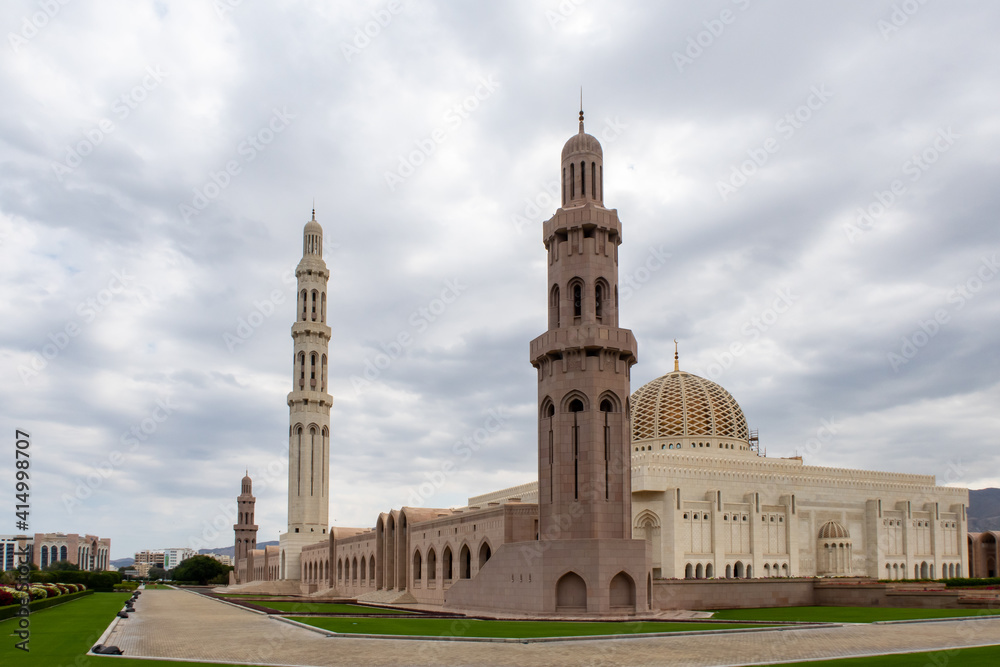 Sultan Qaboos Grand Mosque in Muscat, Oman, exterior view with majestic dome and minaret.