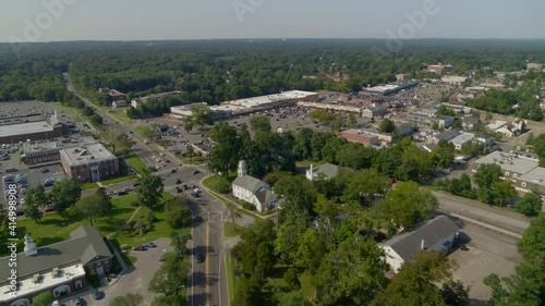 Forward Aerial Pan of a Small Town Amongst Trees in Smithtown Long Island photo