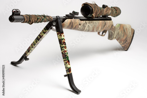 Camoflage air rifle gun with telescopic sights and a stand