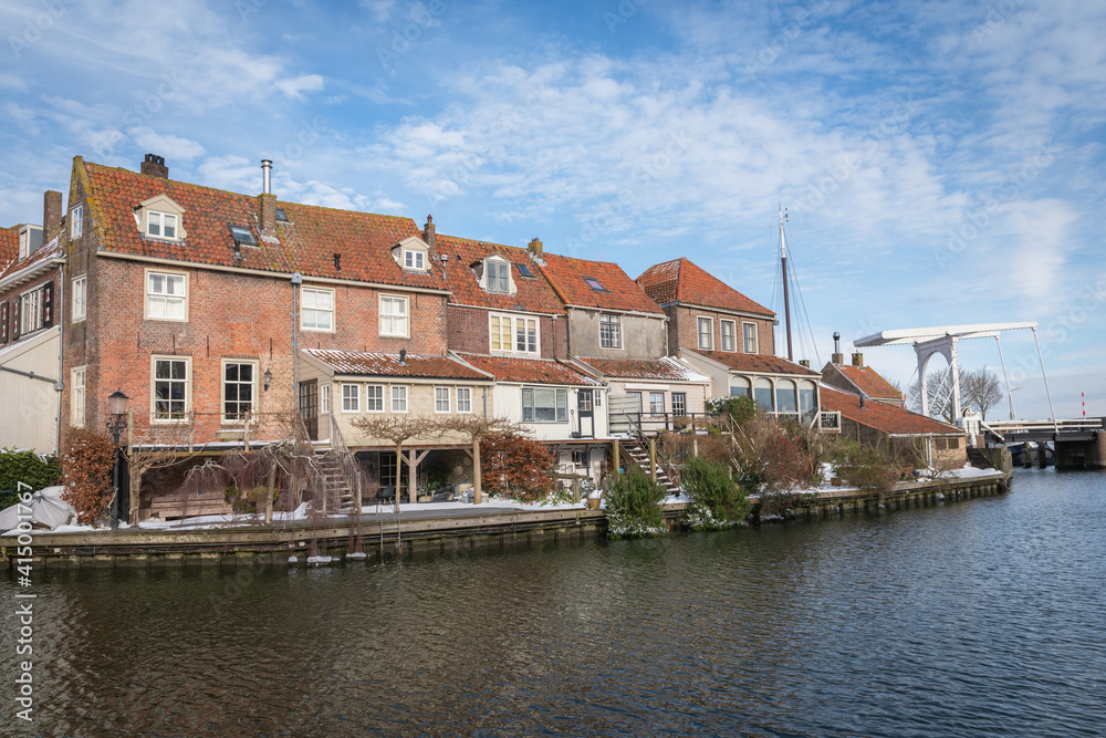 Scenic view of old Dutch houses on the canal in winter