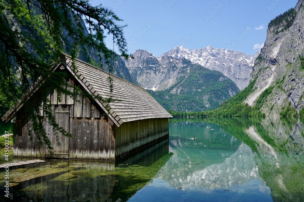 Wooden house in a lake in the Alps